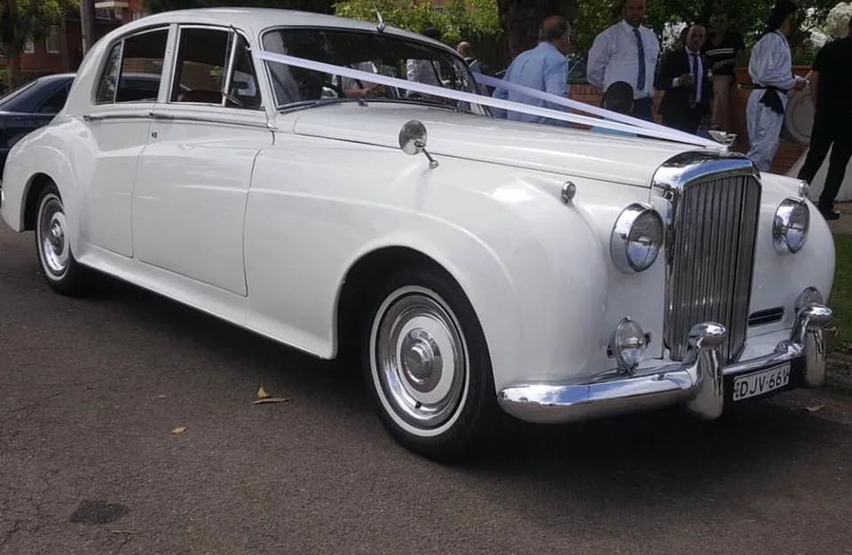 Side profile of white super stretch wedding car