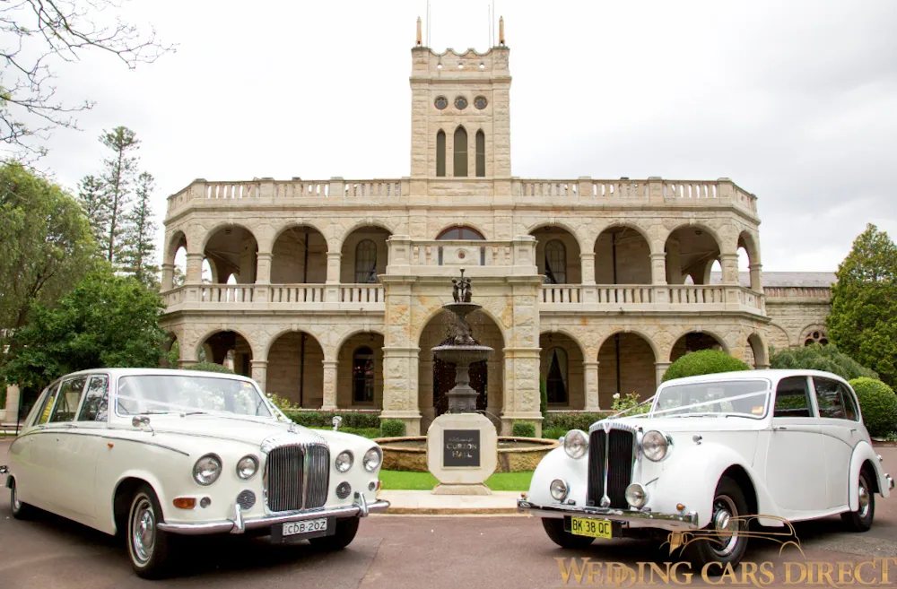 Two white wedding cars together