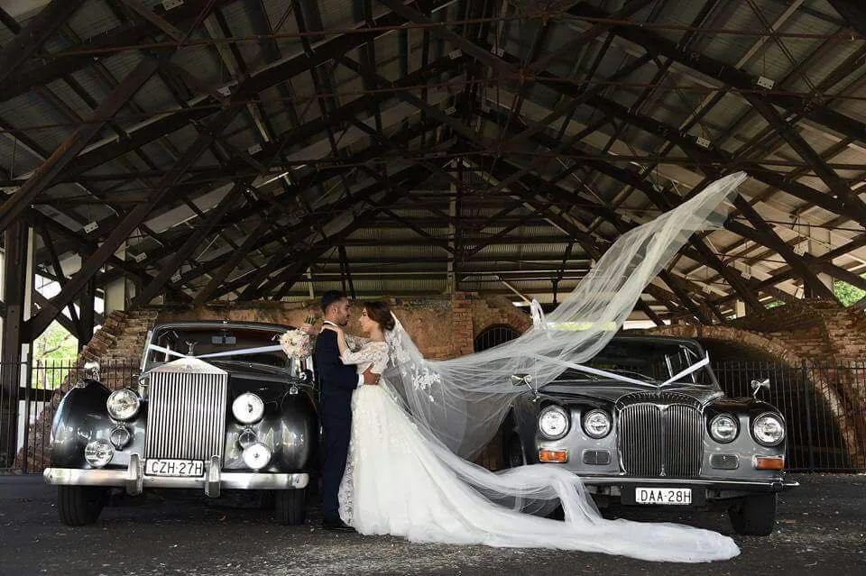 Silver Daimler wedding car at photo location
