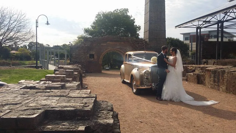 Gold Rolls-Royce wedding car from a distance