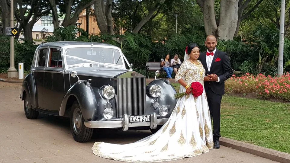 Silver classic wedding car at photo location